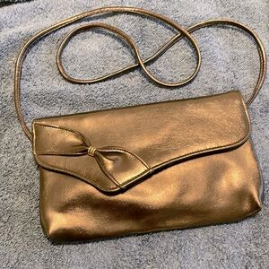 Small black leather purse with bow design